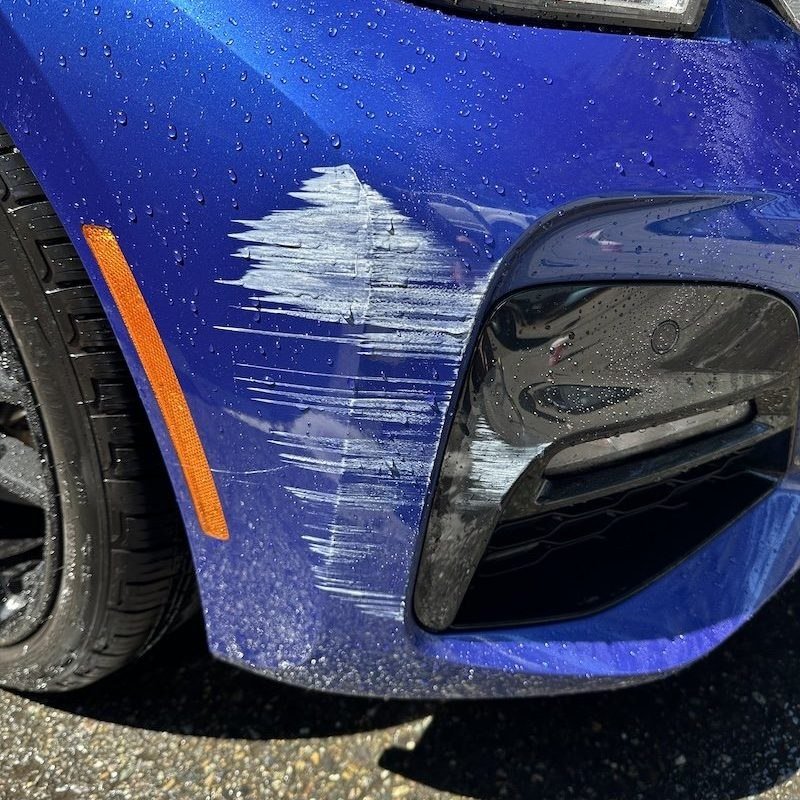Scratched bumper before correction